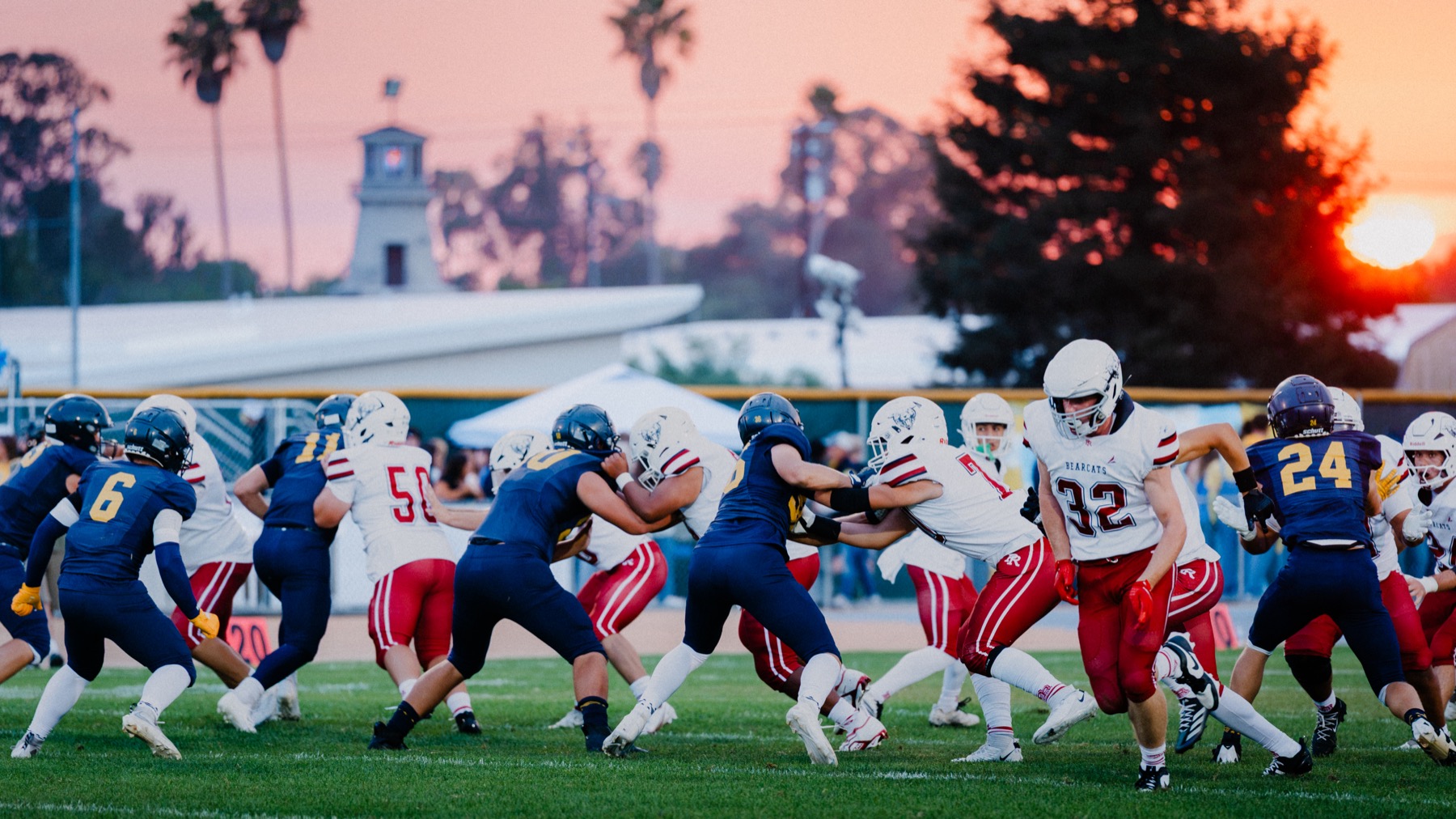 Arroyo Grande in action on the field with the Paso Robles clock tower visible in the distance