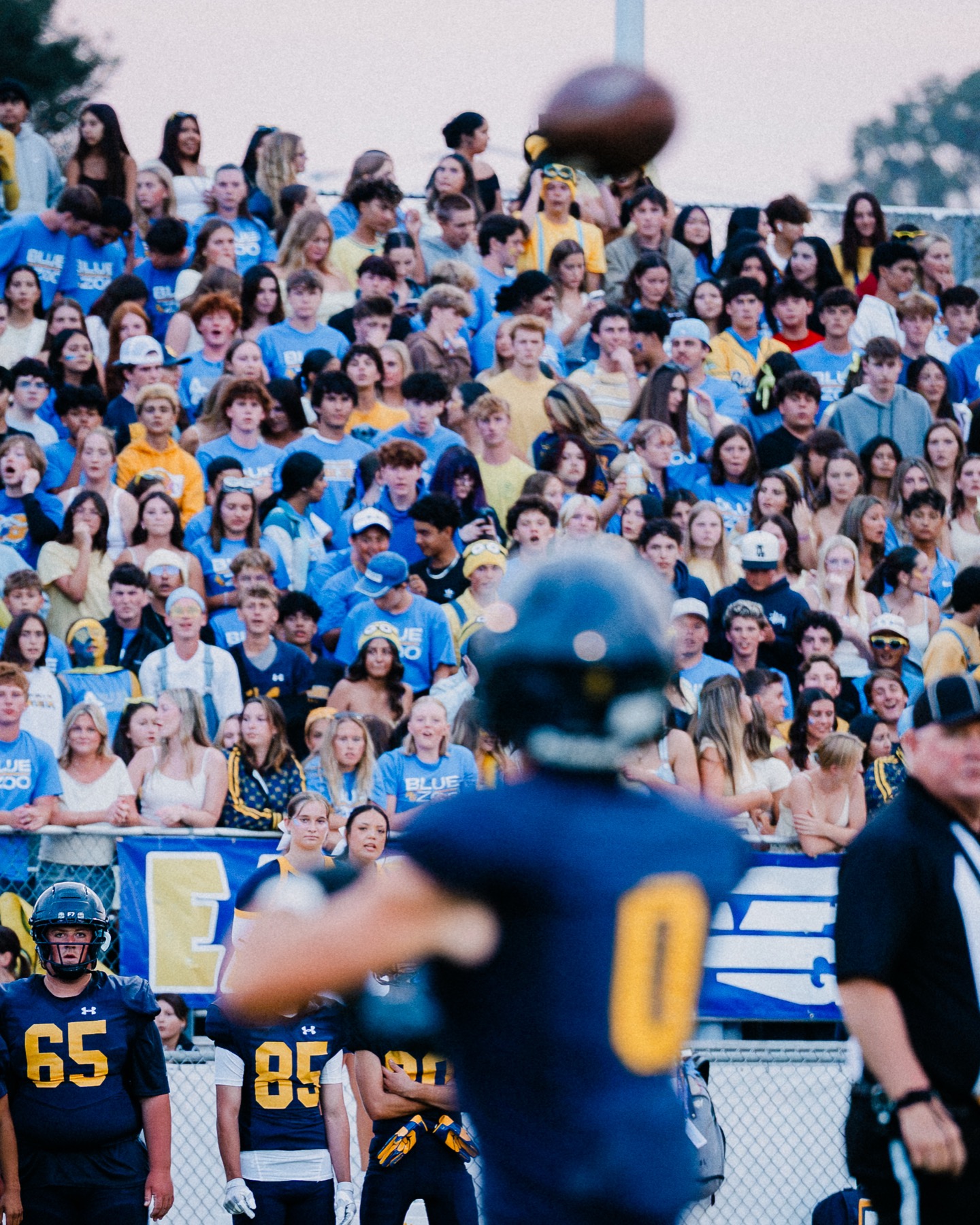 The Arroyo Grande student section watches a pass sail through the air during the home opener