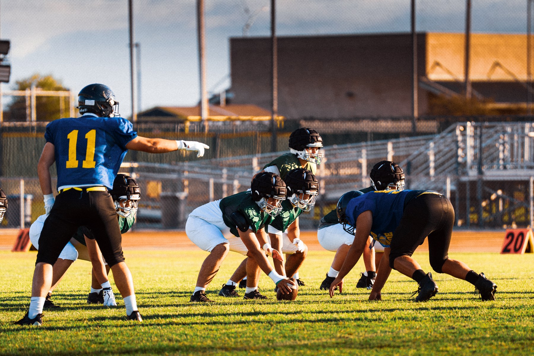 Arroyo Grande quarterback pointing out the defense before the snap